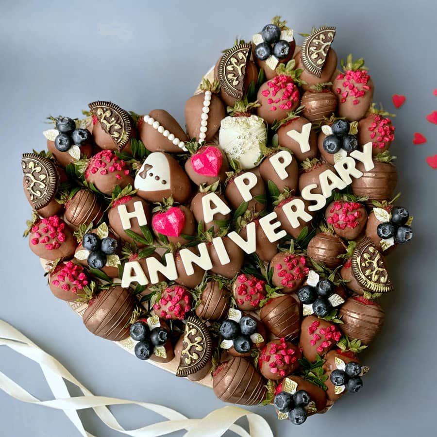 Romantic chocolate covered strawberries with Happy Anniversary lettering for an anniversary gift
